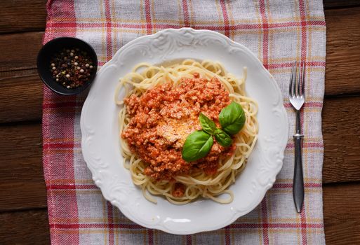 Tasty spaghetti with cheese and basil