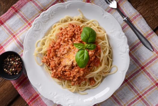 Tasty spaghetti with cheese and basil