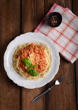 Tasty spaghetti with cheese and basil