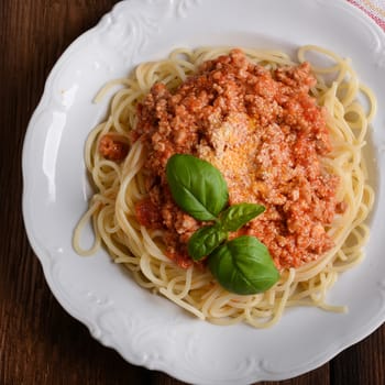 Tasty spaghetti with cheese and basil