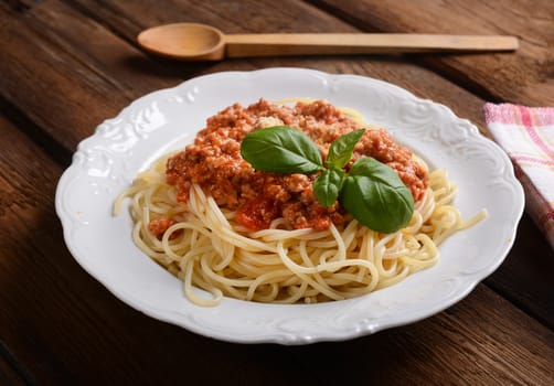 Tasty spaghetti with cheese and basil