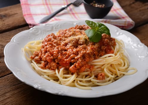 Tasty spaghetti with cheese and basil
