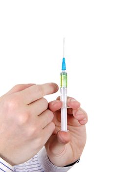 Syringe in a Hand Closeup Isolated on the White Background
