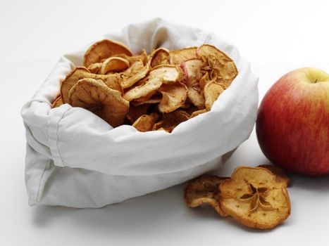 dried apples in the bag with fresh ripe ones