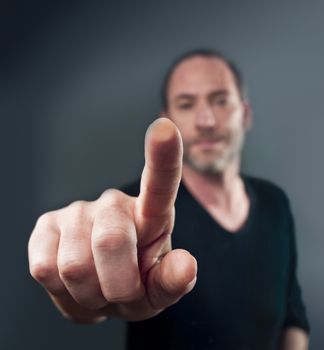 Close-up of a man touching a transparent screen (shot on PhaseOne 45)
