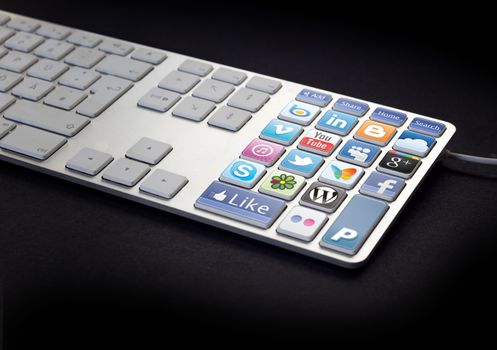 Computer Keyboard with social media and network buttons on black background