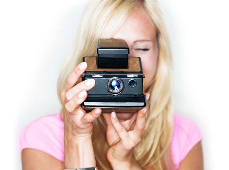 beautiful woman holds vintage photo camera