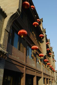 Chinese ancient buildings with red lamps at the city center of Xian, China