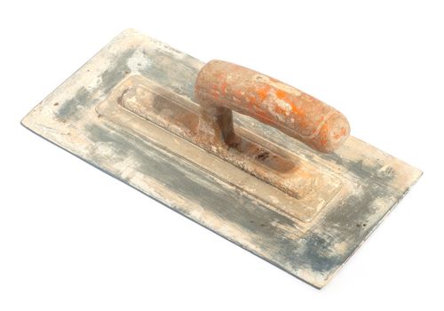 Close up of dirty trowel on white