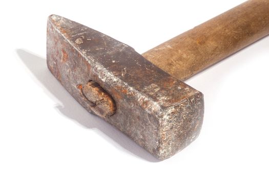 Close up of dirty hammer on white