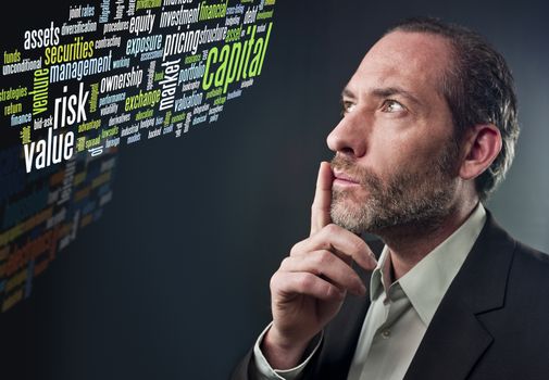 Studio shot of businessman in a deep thought over colored background (shot on PhaseOne 45)