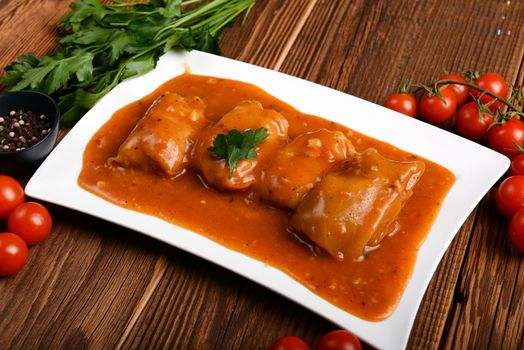 Meat stuffed cabbages on wooden background