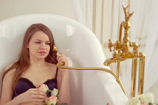 Portrait of a young  woman having fun in shower