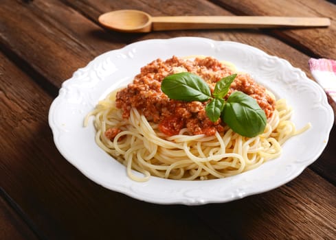 Tasty spaghetti with cheese and basil