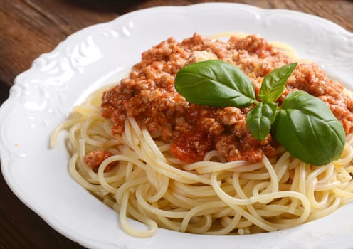 Tasty spaghetti with cheese and basil