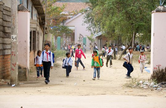 KHANH HOA, VIET NAM- FEBRUARY 5: Chidren has just school is out at countryside, they jump around out school, Khanh Hoa, Viet Nam, February 5, 2013