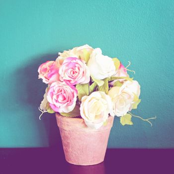 Rose in flowerpot for decoration with retro filter effect