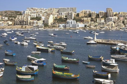 Fishing harbour in the St Paul's Bay and panorama of Xemxija in the background - San Pawl il-Baħar, Malta