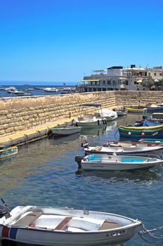 Vessels moored in the boat shelter in the old part of fishing village of St Paul's Bay - San Pawl il-Baħar, Malta