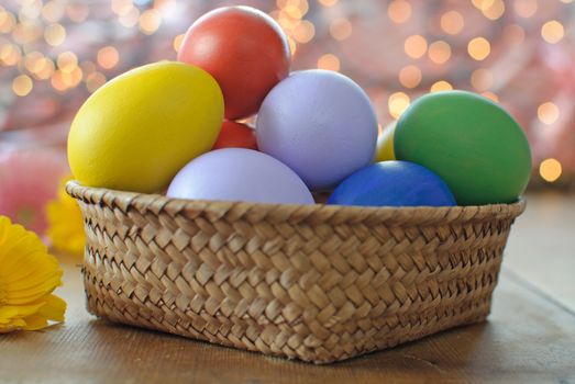 Easter eggs inside a wicker basket 