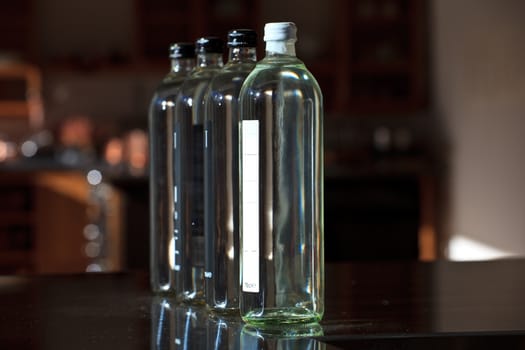 A lot of water bottles in the kitchen