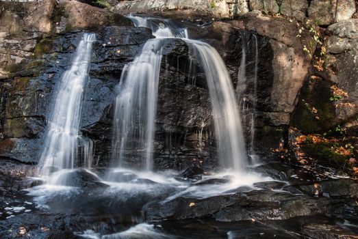 Water flowing at full force at a waterfall