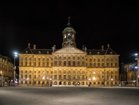 beautiful royal palace at night in amsterdam