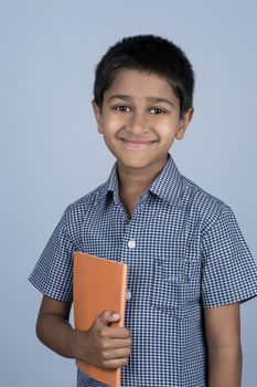 Handsome Indian toddler ready to go to school