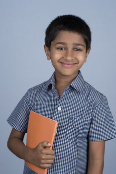 Handsome Indian toddler ready to go to school