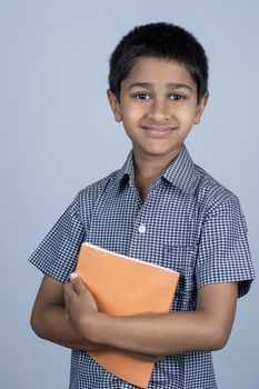 Handsome Indian toddler ready to go to school