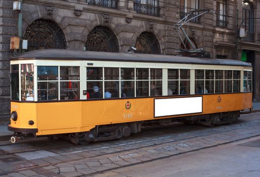 View of old yellow tram in Milan, italy