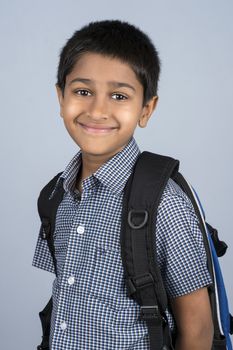 Handsome Indian toddler ready to go to school