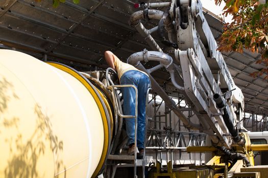 View of Cement Truck in action in a construction site