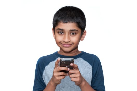 An handsome indian kid playing games with the mobile phone
