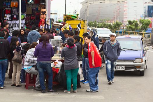 LIMA, PERU - JULY 21, 2013: Unidentified people around a food stand at the mall Polvos Azules on the Av. Paseo de la Republica on July 21, 2013 in the center of Lima, Peru.