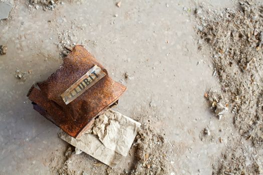 View of rusted pail in an abandoned house