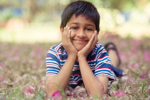 An handsome toddler having fun in the park