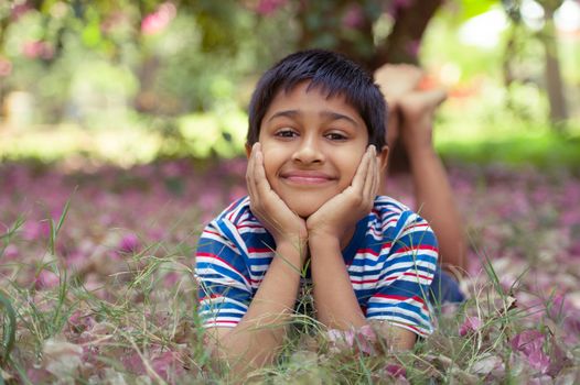 An handsome toddler having fun in the park