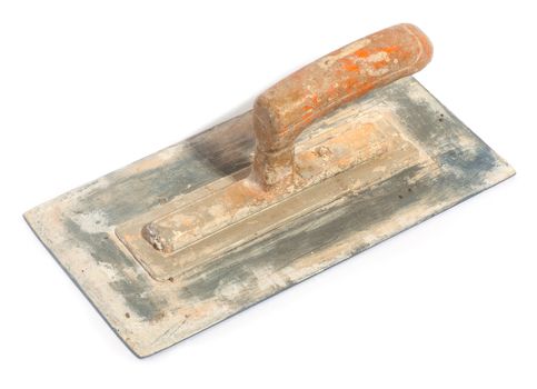 Close up of dirty trowel on white