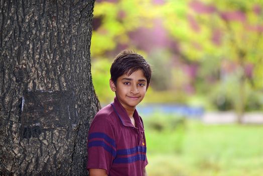 Handsome Indian toddler standing outdoor smiling