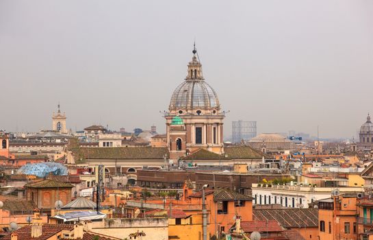 View of San Marcello al Corso church and Rome roofs from Pincio