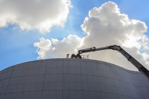 Crane working on modern building in Pordenone