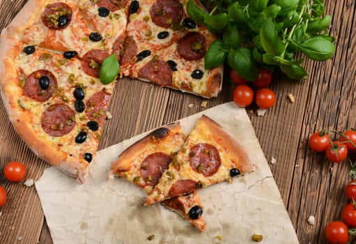 Tasty pizza with olives and salami