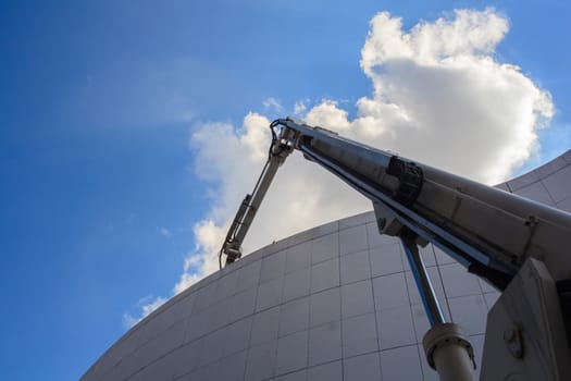 Crane working on modern building in Pordenone