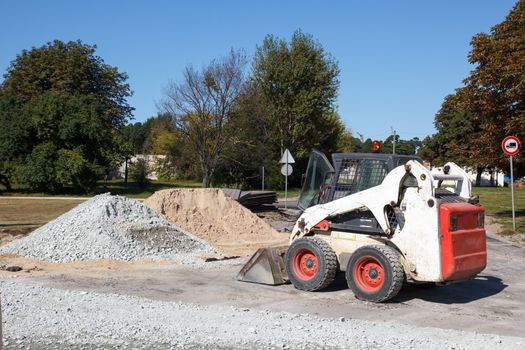 small excavator bobcat on the construction site