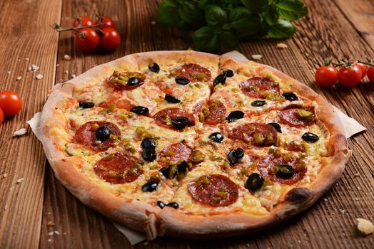 Tasty pizza with olives and salami