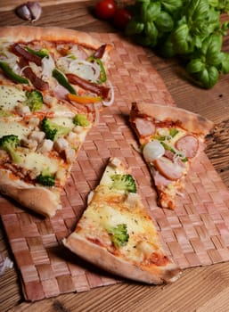 Tasty pizza with broccoli on old wooden background