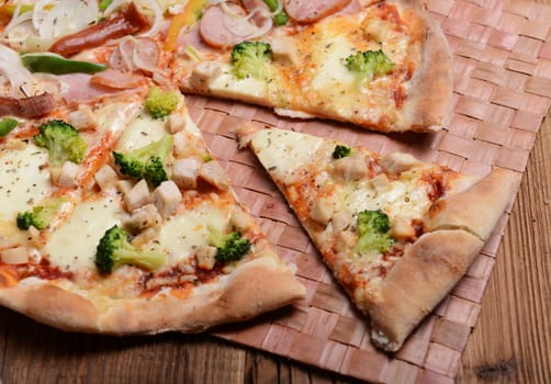 Tasty pizza with broccoli on old wooden background