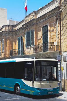 St Paul's Bay, Malta - July 3, 2012: Modern Maltese bus at bus bus stop.