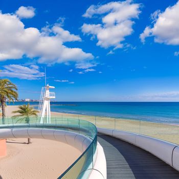 Alicante el Postiguet beach playa with modern pedestrian white bridge at Spain